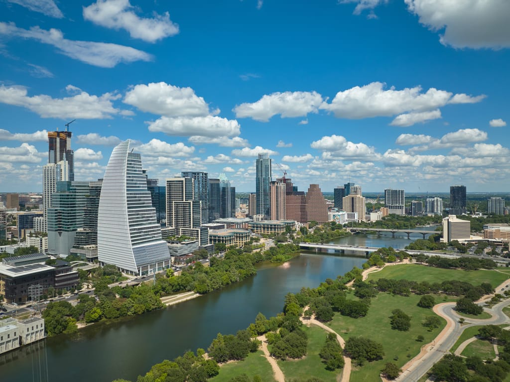 Central Austin from the air, with the downtown towers behind the river.
