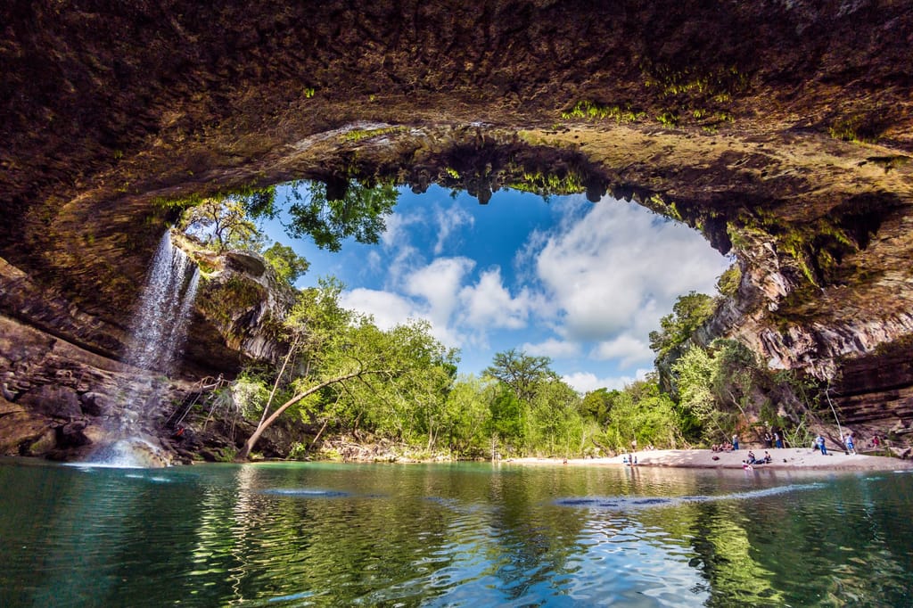A hill country property outside Austin with open land and scattered oaks.