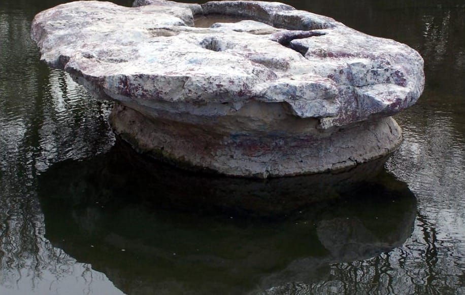 The flat limestone boulder in Brushy Creek that gave Round Rock its name