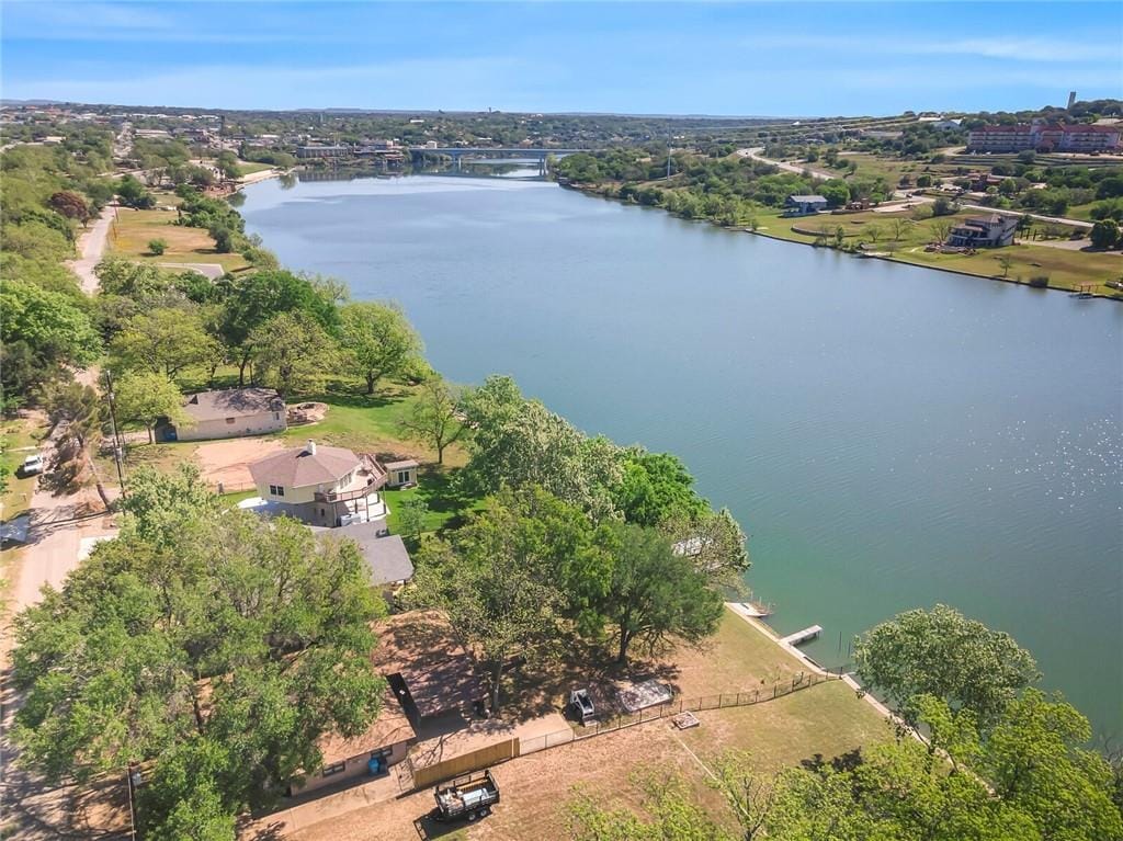 The Lake Marble Falls shoreline below the Hill Country, the highway bridge crossing in the distance