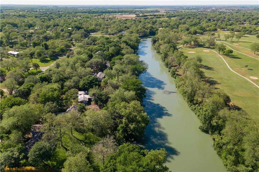 A narrow stretch of Lake Seguin winding between wooded banks, seen from the air